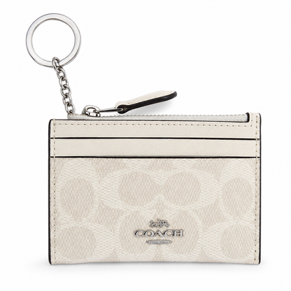 Tarjetero Coach beige con herrajes dorados - vista frontal